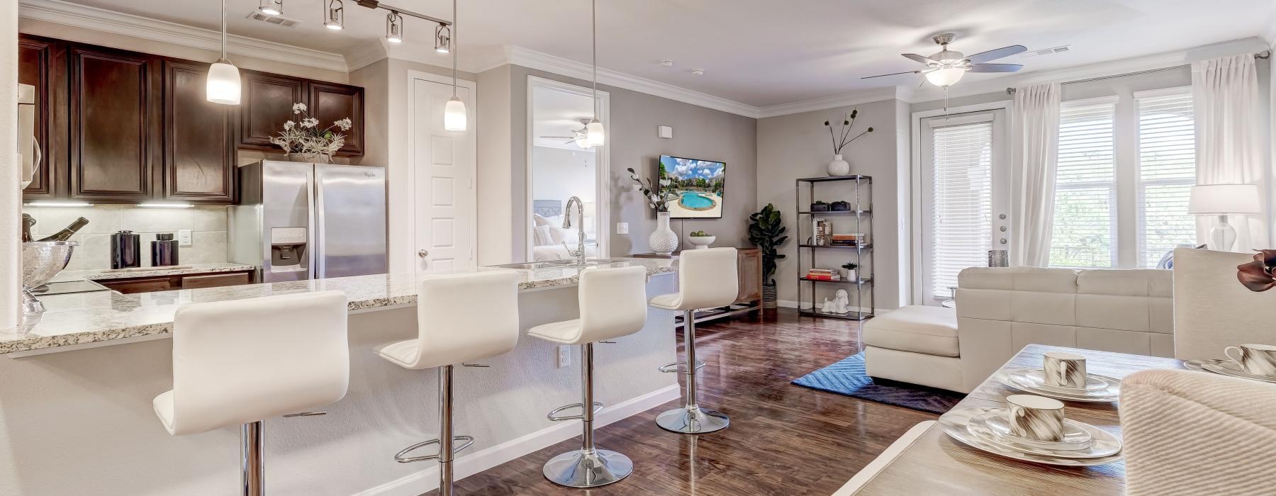 a large living room with a large dining table and chairs