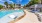 a swimming pool in front of a building