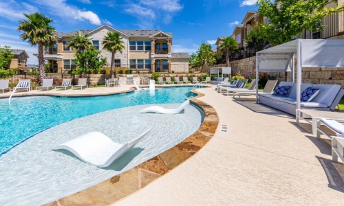 a swimming pool in front of a building