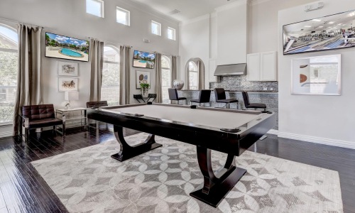 a room with a table and chairs