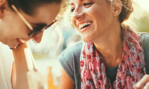 two women laughing