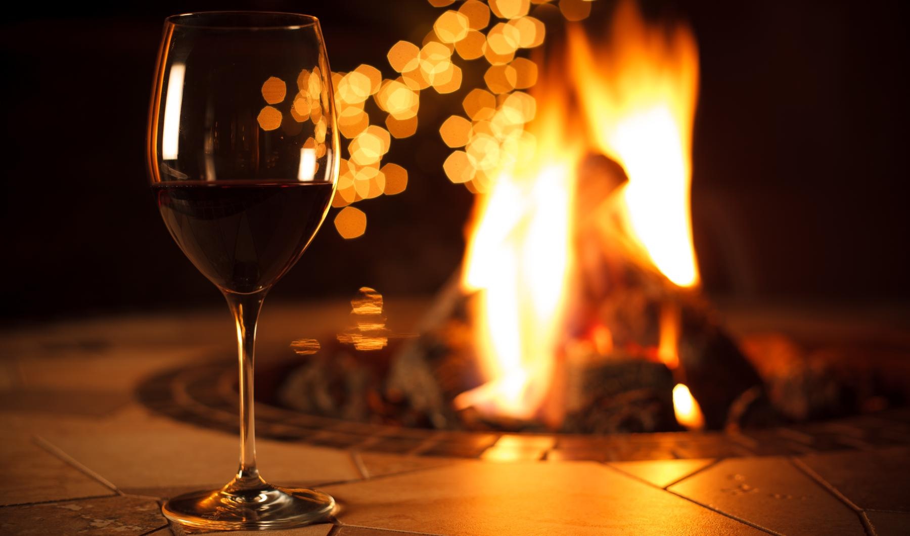 Settle into comfort at Berkshire Lakeway a glass of wine next to a fire