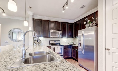 a kitchen with a marble countertop